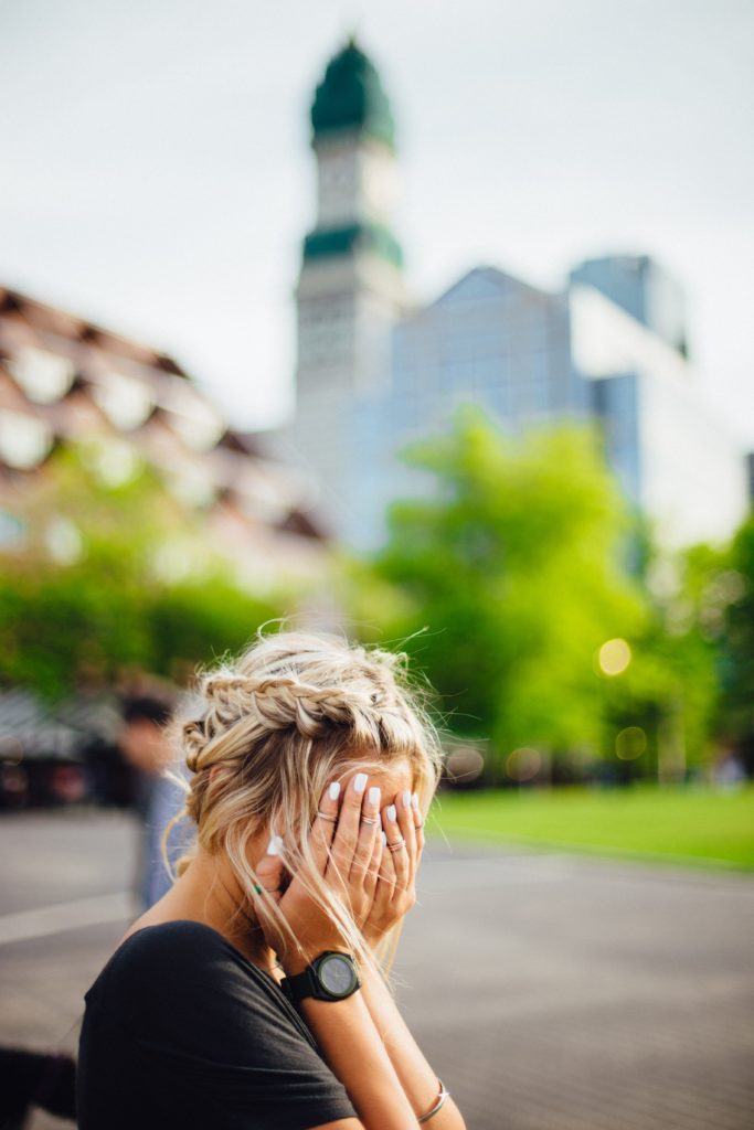 Image of a woman sitting outside covering her face. Do you suffer from chronic disease? Are you ready to talk to a functional medicine doctor in the Chicago area 60491? Get in contact with us today to book an appointment for functional medicine in Orland Park, IL 60487.