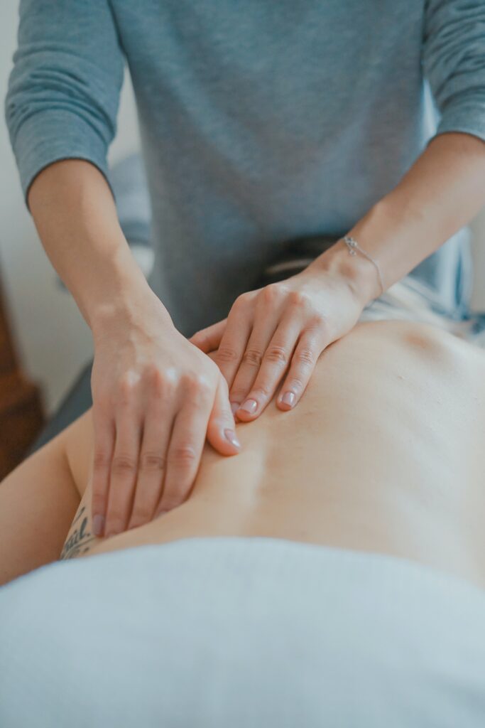 Image of a massage therapy session. Representing how a massage therapist can tailor sessions for your needs. This include prenatal massage and post natal massage as well.