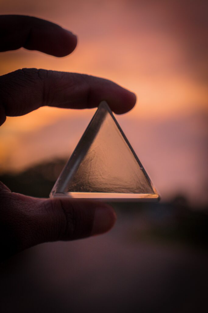 Image of two fingers holding up a glass triangle with a blurred background. As a holistic chiropractor in the Chicago area I believe in the Triad of Health. This include using massage therapy and chiropractic care in Orland Park, IL 60467. Reach out today to speak with a holistic chiropractor in the Chicago area. 