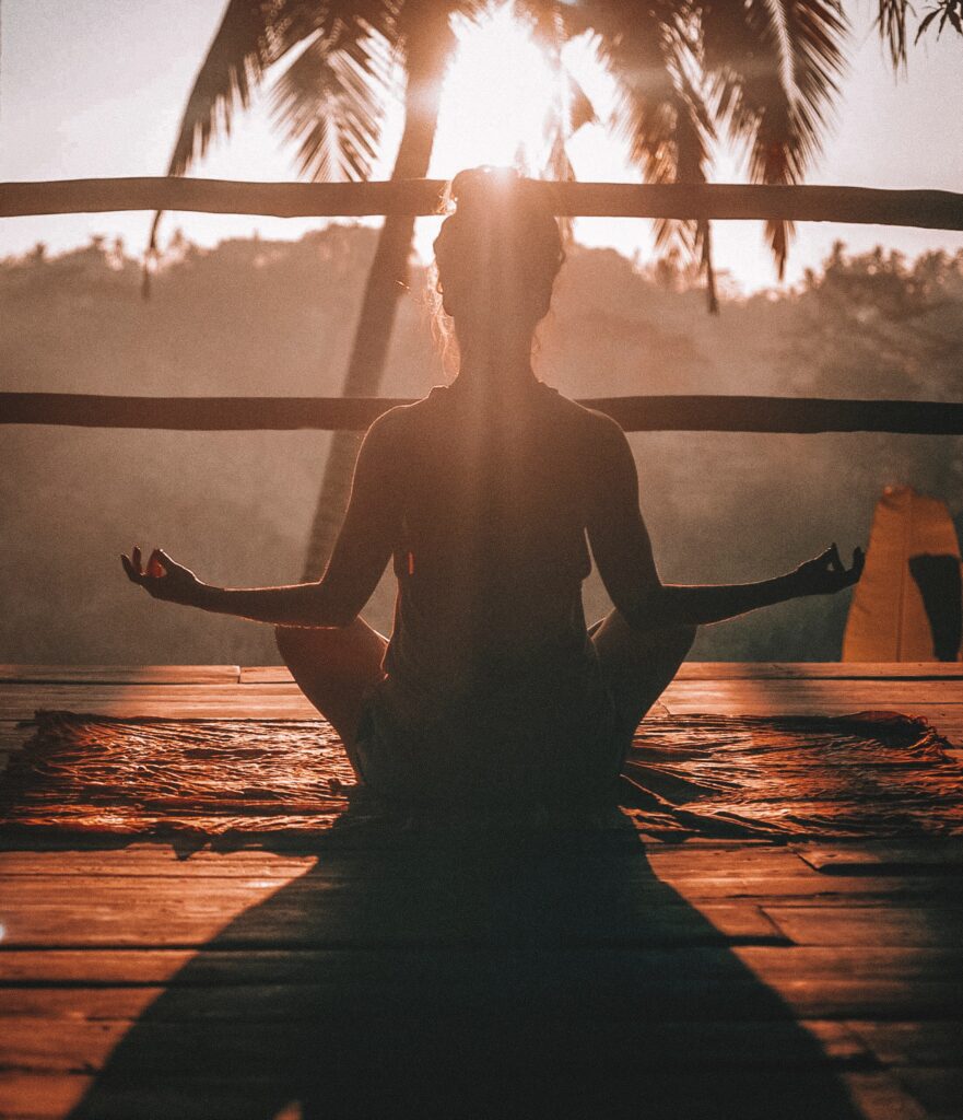 Image of a woman meditating outside. Are you looking for a "holistic doctor near me" in Orland Park, IL 60449? Then  we can help with functional medicine. Learn more about our functional medicine doctor in Orland Park, IL 60464. Call today!