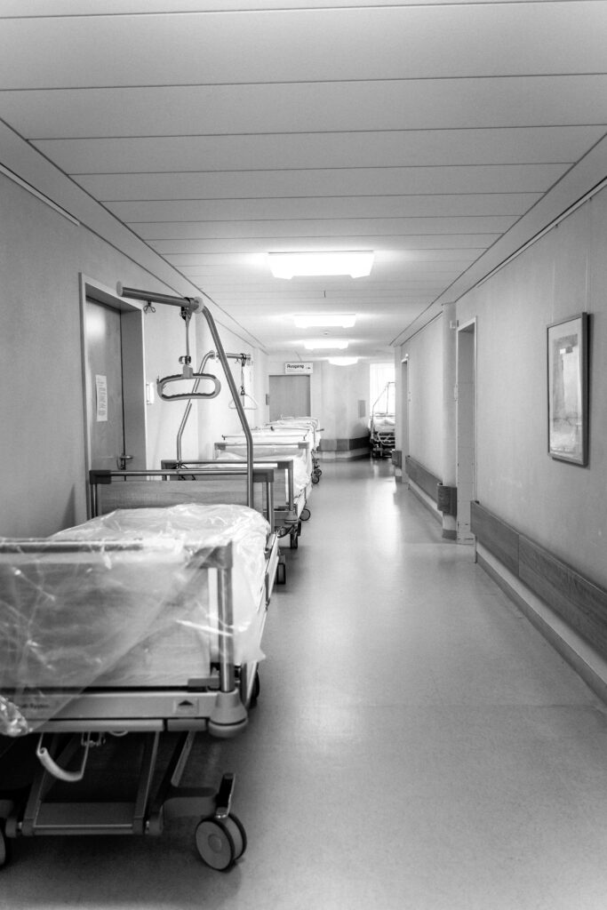 Image of a hallway in a hospital with hospital beds & equipment. If you are looking for a "holistic doctor near me"  to help you restore health we can help.   You no longer have to wonder what is chronic disease. With Functional Medicine in Orland Park, IL you can finally feel better and have your questions answered. Call today!