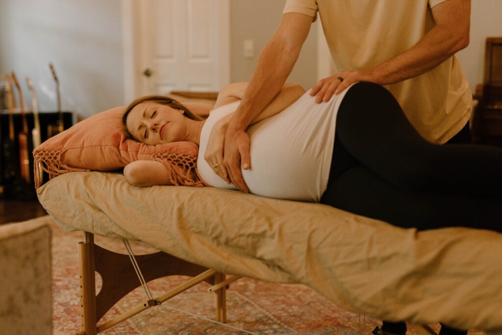 Image of a pregnant woman receiving a therapeutic massage in Orland Park, IL. During holistic massage everything is detailed to your needs. therapeutic massage in orland park, il