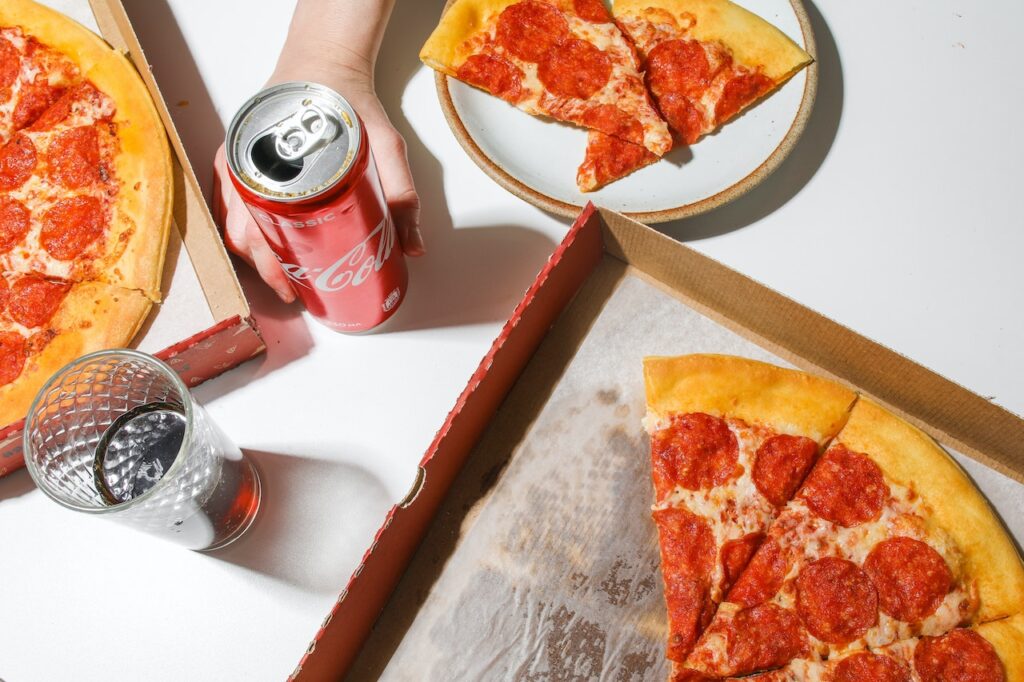 A close up view of open pizza boxes and soda. Learn more about diabetes functional medicine in Orland Park, IL and the support a holistic doctor in Orland Park, IL can offer by searching for “functional medicine doctor in the Chicago area” today.
