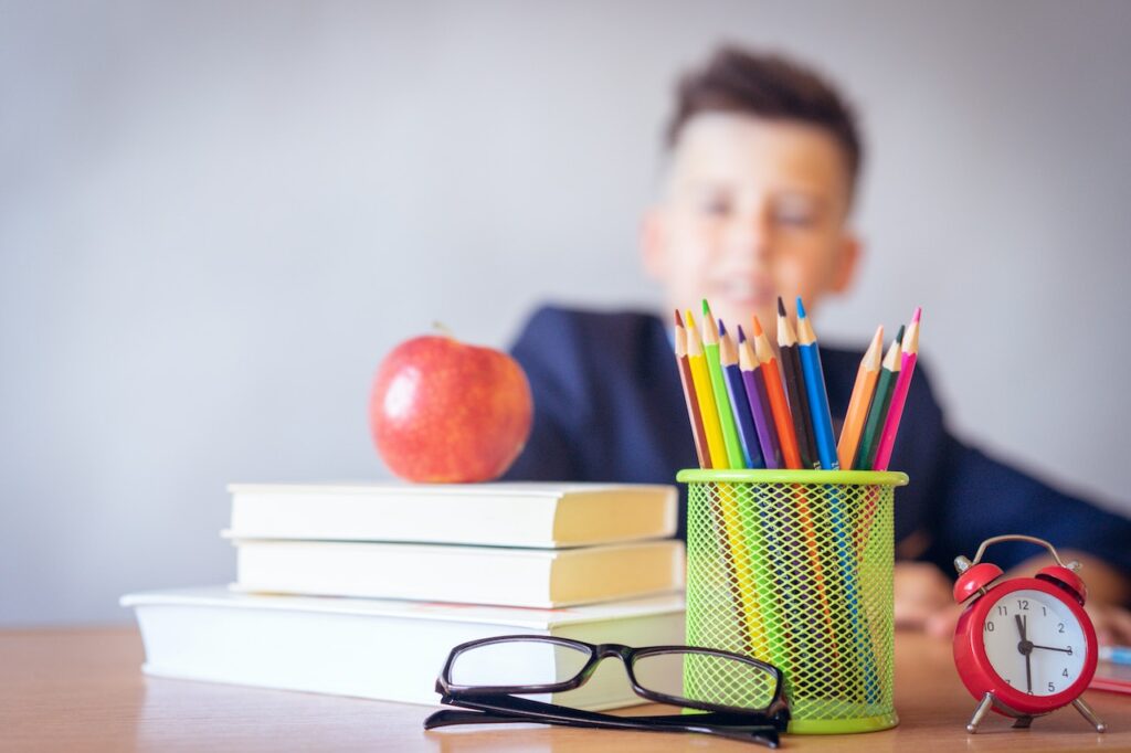 A close up of school supplies and a  young student. Learn how chiropractic care in Orland Park, IL can help make the most of the school season. Search for "chiropractor Orland Park" to learn more about how a chiropractor for sciatica in Orland Park, IL can help. 
