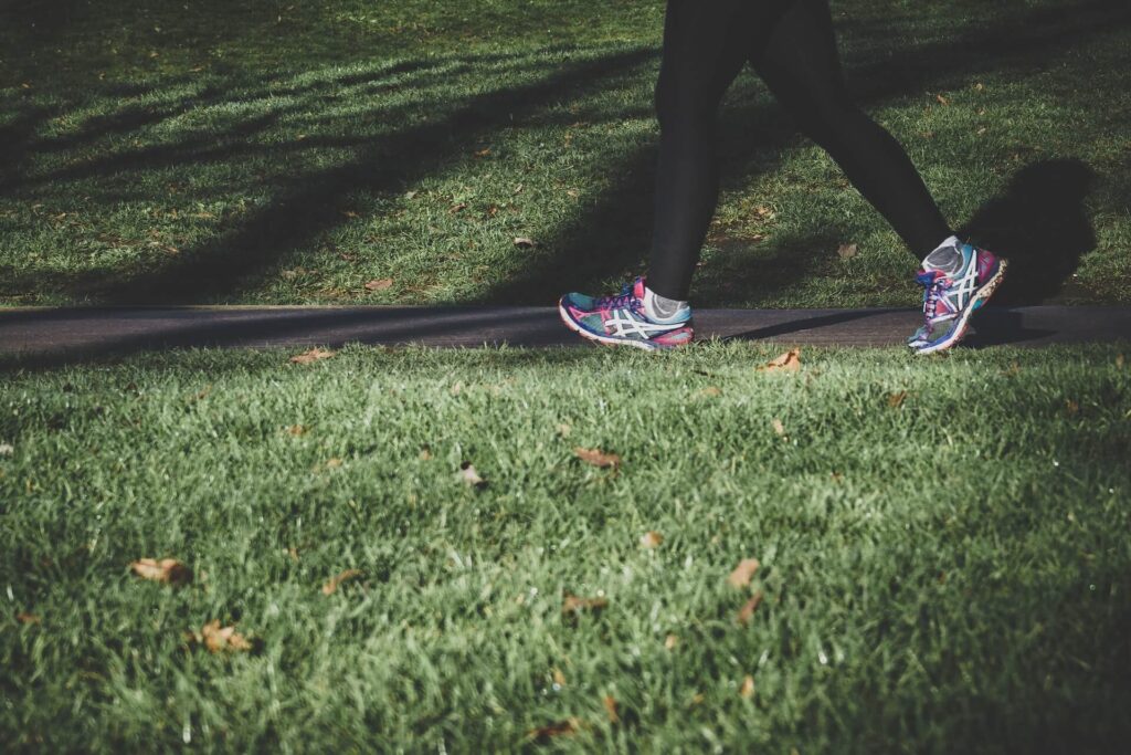 A close up of a person jogging on a sidewalk. Learn how exercise can support you with detoxification in Orland Park, IL. Search for “what is functional medicine Chicago area” and contact a holistic doctor in Orland park, IL for support.
