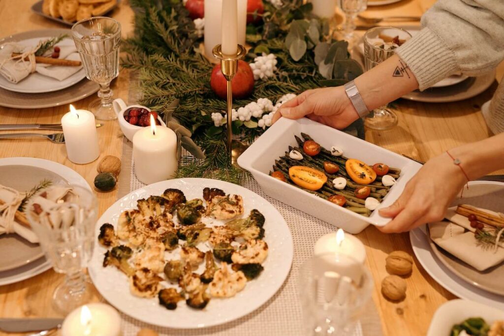 A close up of a family feast while passing around food. Search for a holistic doctor in Orland Park, IL for tips on staying healthy during the holidays. Learn more about how a functional medicine doctor in Orland Park, IL can help today. 
