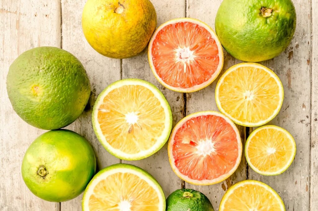 A top down view of citrus fruits cut in to slices on a wooden table. Learn more how lemons, limes, and more can help with detoxification in Orland Park, IL by contacting a holistic doctor in Orland Park, IL. Search for holistic medicine in the Chicago area for help today. 
