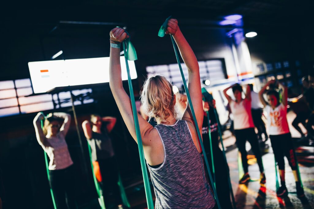 A woman extends a resistance band while standing with an exercise group. This could symbolize how exercise can reduce inflammation. Learn how acupuncture in Orland Park, IL can help relieve sciatic pain in Orland Park, IL by searching for an acupuncturist in the Chicago area today.
