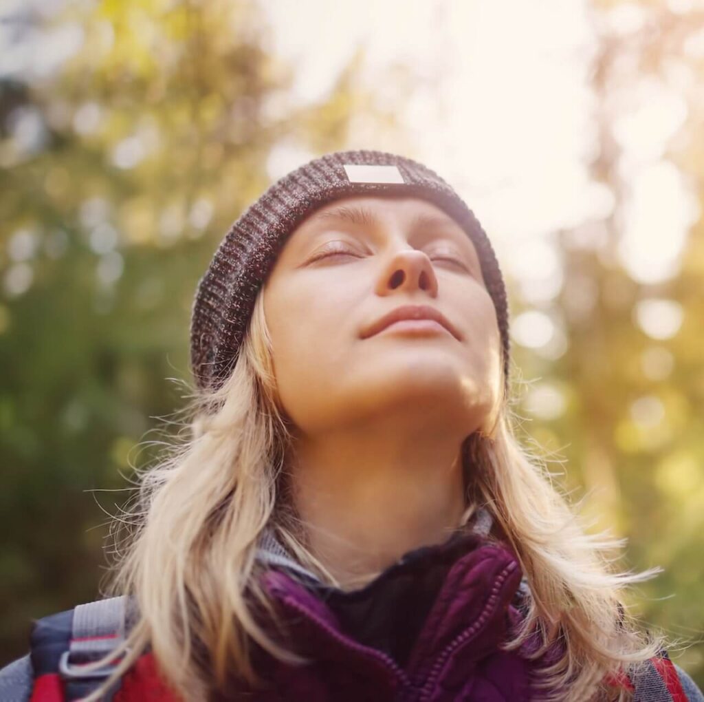 A close up of a woman breathing with her eyes closed and taking in the sunlight around her. Learn how natural remedies for constipation in Orland Park, IL can help you reduce stress. Search for acupuncture in Orland Park, IL and how an acupuncturist in Orland Park, IL can help you today.
