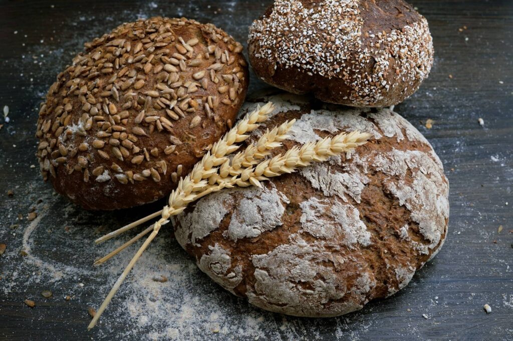 A close up of bread and wheat. This could represent a trigger food for IBS and not a natural remedy for constipation in Orland Park, IL. Search for acupuncture in Orland Park, IL and how holistic acupuncture Orland Park, IL can offer support today.
