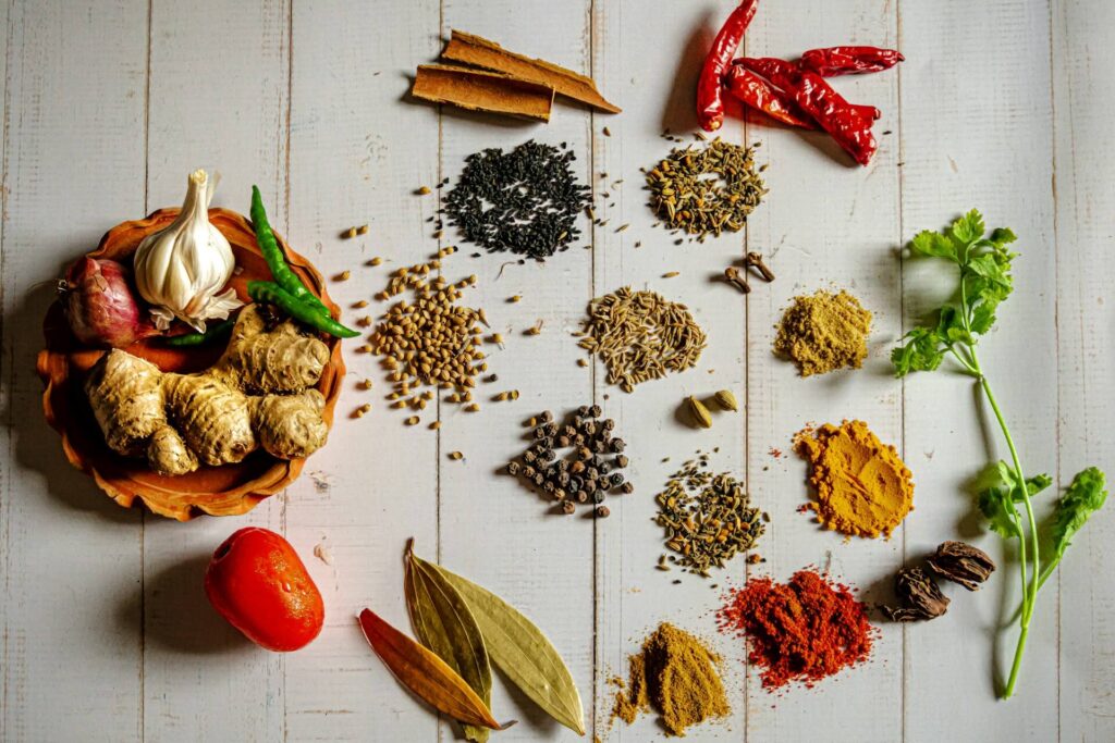 A top down view of different spices in small piles on a table. Contact a holistic doctor in Orland Park, IL to learn more about the benefits of spices and other forms of inflammation resistance. Learn how chiropractic care in Orland Park, IL can offer support by searching for chiropractor orland park today. 
