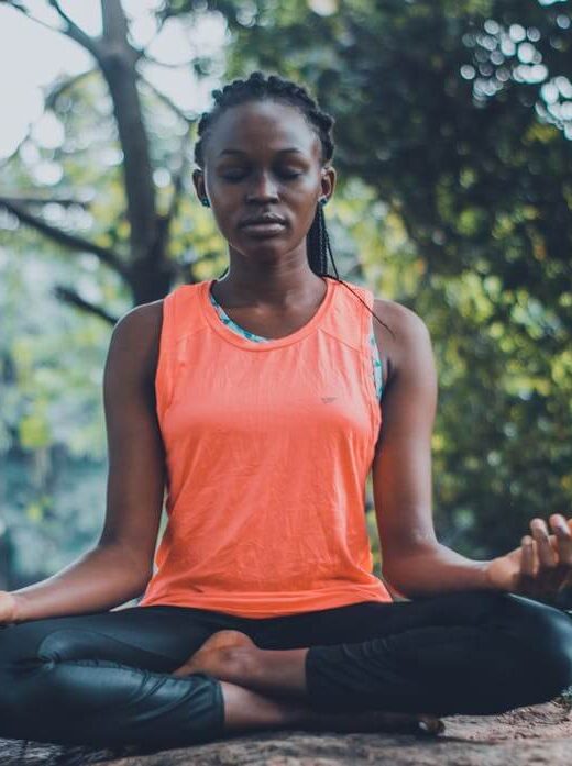 A black woman sits outside while meditating with legs crossed. Learn how holistic medicine in the Chicago area can offer support with vagus nerve issues. Contact a holistic doctor in Orland Park, IL for more info on how a holistic massage in Orland Park, IL can help.