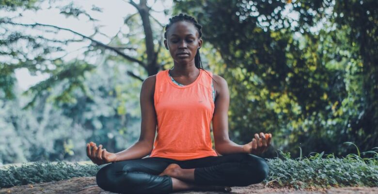 A black woman sits outside while meditating with legs crossed. Learn how holistic medicine in the Chicago area can offer support with vagus nerve issues. Contact a holistic doctor in Orland Park, IL for more info on how a holistic massage in Orland Park, IL can help.