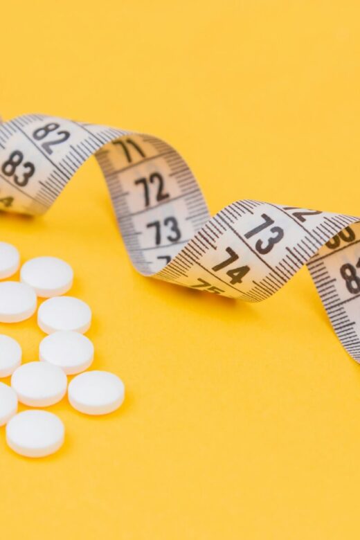 A close up of a measuring tape and pills against a yellow background. Learn how Shape ReClaimed in the Chicago area can offer an alternative to GLP-1 injections. Search for a holistic doctor in Orland Park, IL to learn more.