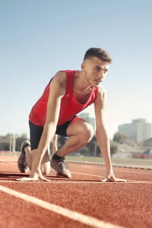 A runner on a track crouches down, ready to start their training. Learn more about chiropractic care in Orland Park, IL and how a Chiropractor Orland Park can offer support. Search for a holistic chiropractor in the Chicago area today.