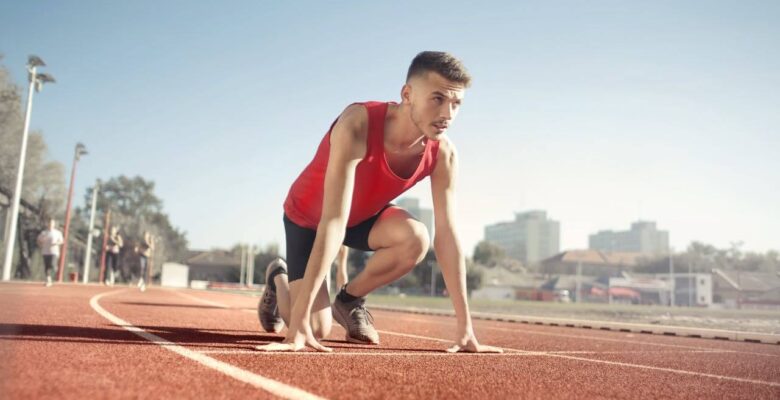 A runner on a track crouches down, ready to start their training. Learn more about chiropractic care in Orland Park, IL and how a Chiropractor Orland Park can offer support. Search for a holistic chiropractor in the Chicago area today.