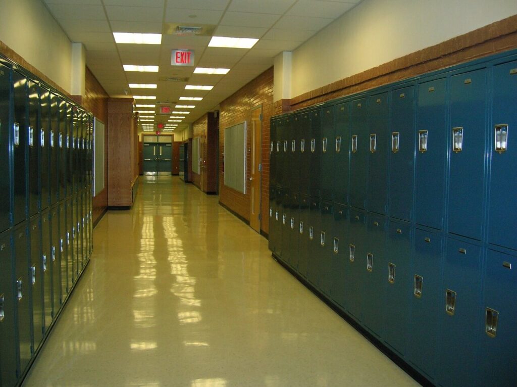 An image of an empty school hallway for Anchored in Health. Learn more about overcoming school stress with a therapeutic massage in Orland Park, IL. Search for a massage therapist in Orland Park, IL to learn more about massage therapy in Orland Park, IL today. 
