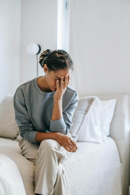 A woman with a pained expression touches her face with her hand. This could represent the pain of POTS that functional medicine in Orland Park, IL can address. Learn more about how a functional medicine doctor in the Chicago area can offer support. Search for holistic medicine in the Chicago area to learn more today.