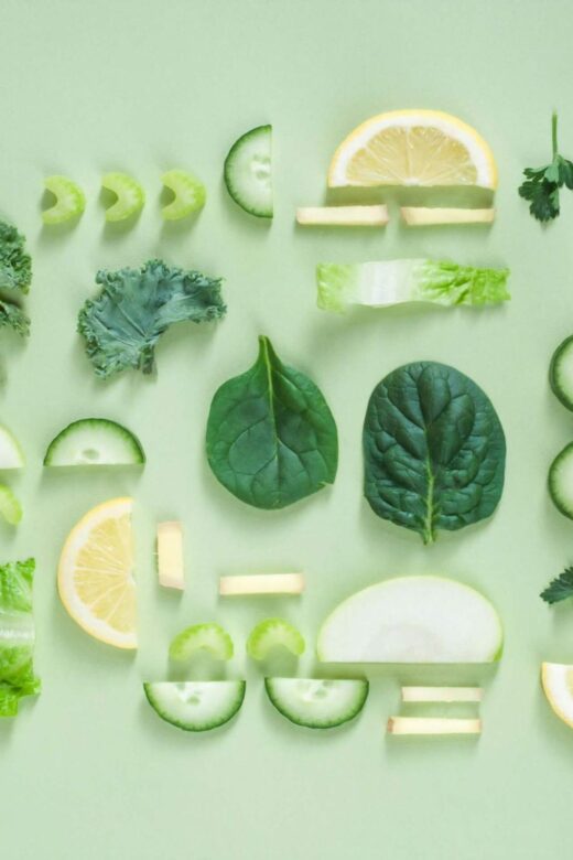 A top down view of various green foods inluing parsley, lettuce, spinach, and more. Learn more about how a holistic doctor in Orland Park, IL can offer support by searching for holistic acupuncture Orland Park, IL today.