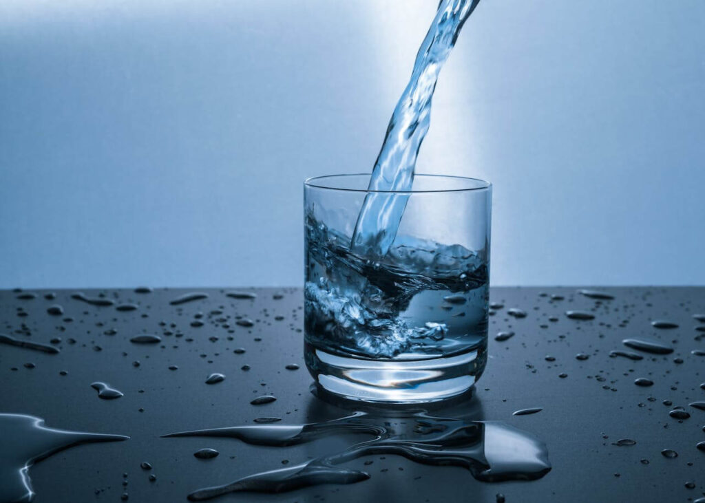 A close up of water being poured into a glass. Contact a holistic doctor in Orland Park, IL to learn more about holistic benefits of things like chiropractic care in Orland Park, IL today. They can offer holistic acupuncture Orland Park, IL and more. 
