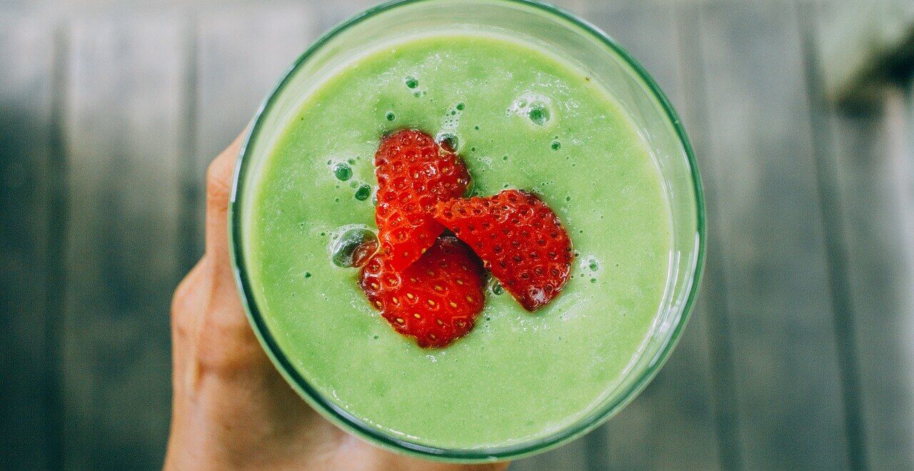 A top down view of a person holding a smoothie with strawberries in the center. Learn holistic solutions for detoxification in Orland Park, IL by contacting a holistic doctor in Orland Park, IL. Search for holistic medicine in the Chicago area today.