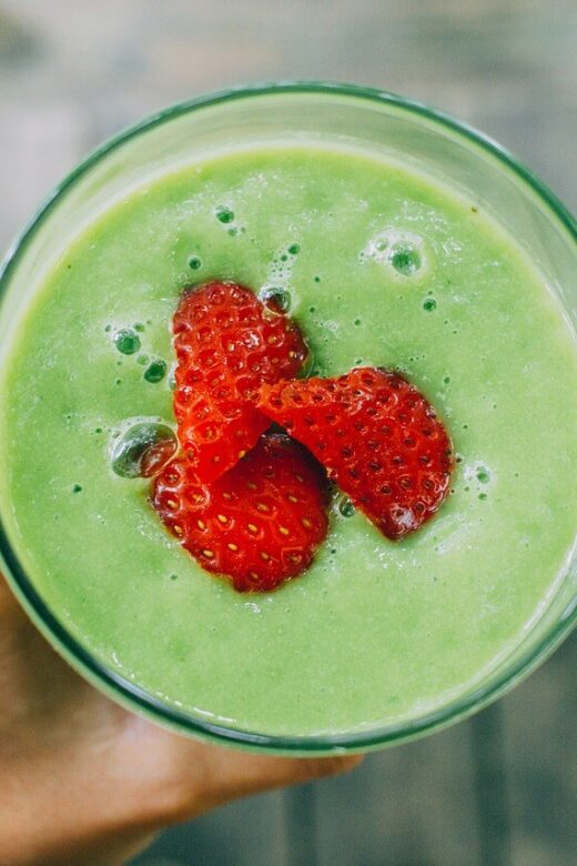 A top down view of a person holding a smoothie with strawberries in the center. Learn holistic solutions for detoxification in Orland Park, IL by contacting a holistic doctor in Orland Park, IL. Search for holistic medicine in the Chicago area today.