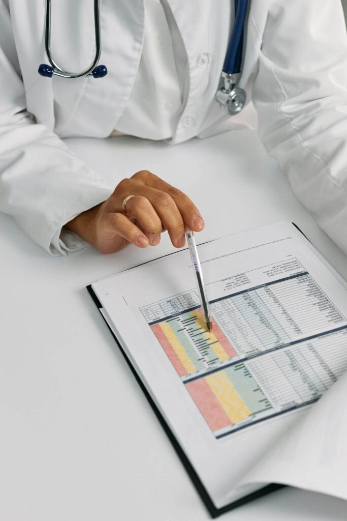 Reviewing a Chart | holistic doctor in chicago, il | holistic medicine in the chicago area | functional medicine doctor in orland park, il | functional medicine doctor in the chicago area | Lincoln Park, IL | Gold Coast, IL | Streeterville, IL Shows a doctor reviewing a patient's medical chart. Represents how functional medicine in orland park, il with a holistic doctor in chicago, il gives you more say in your medical care.