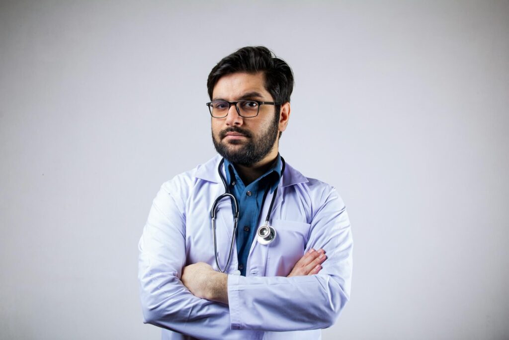 Feeling Skeptical | holistic medicine in the chicago area | functional medicine doctor in orland park, il | functional medicine doctor in the chicago area | functional medicine in orland park, il | Orland Woods, IL | Park Station Boulevard area, IL | Silo Ridge, IL Shows a doctor with his arms crossed looking skeptical. Represents how working with a holistic doctor in chicago, il who practices holistic medicine in the chicago area will acknowledge your expertise on your own body.
