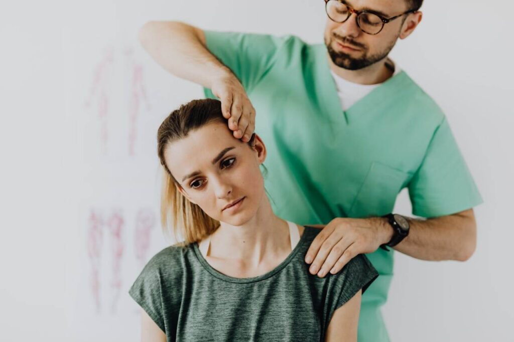 Shows a holistic chiropractor in the chicago area performing an adjustment. Represents how chiropractic care in orland park, il can have positive affects on your mental health.