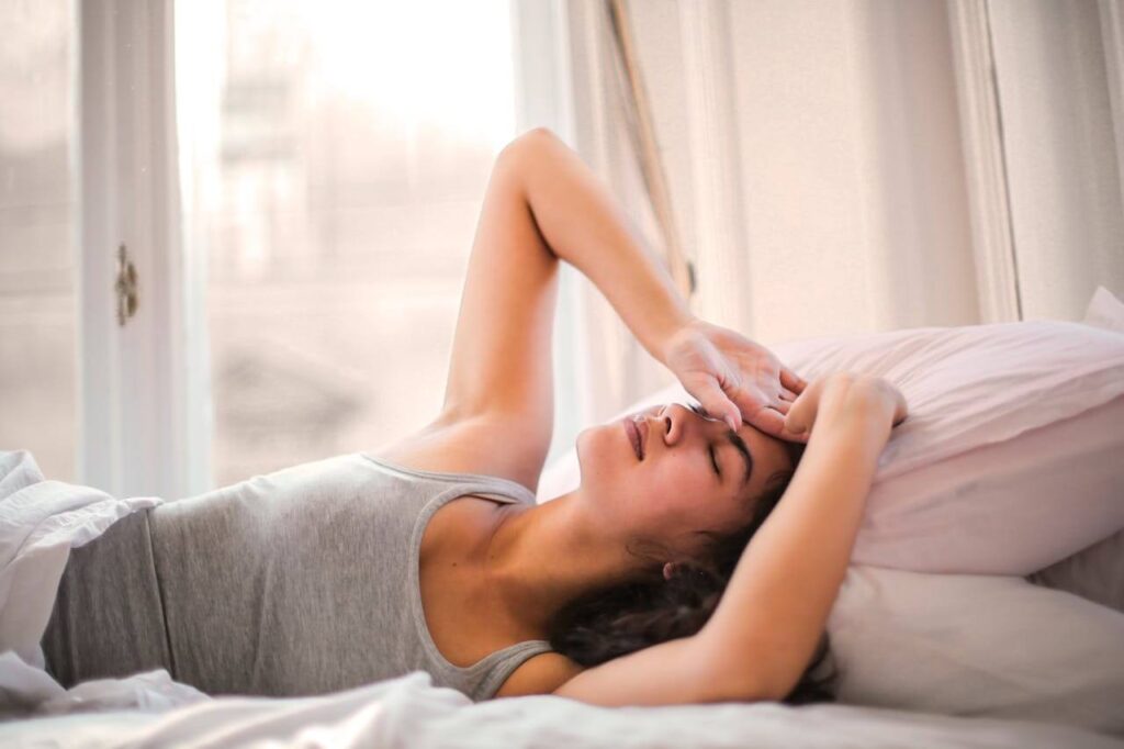 Trouble Sleeping | acupuncture in orland park, il | lymphatic drainage massage in orland park, il | functional medicine doctor in orland park, il | functional medicine in orland park, il | Orland Park, IL | Chicago, IL | Des Plaines, IL Shows a woman struggling to sleep in bed. Represents how functional medicine in orland park, il prioritizes sleep when you're sick but can also talk to you about other methods like acupuncture in orland park, il.