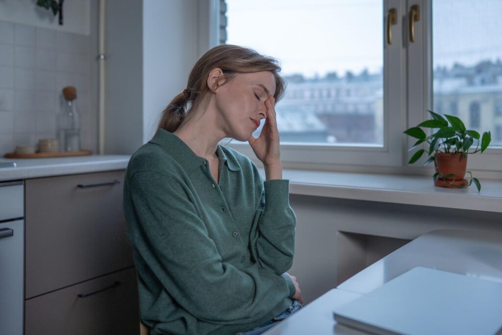 Frustrated woman experiencing fatigue despite normal lab results. Feel better with functional medicine in Orland Park, IL.