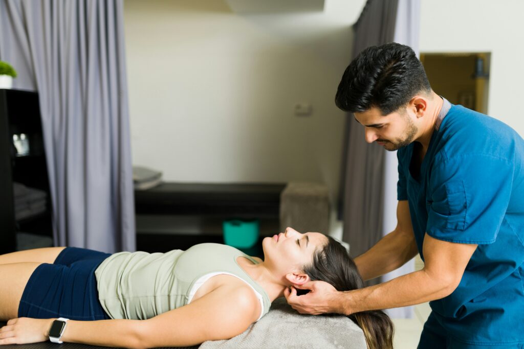 Female patient getting a safe neck adjustment from a chiropractor in Orland Park, Illinois.